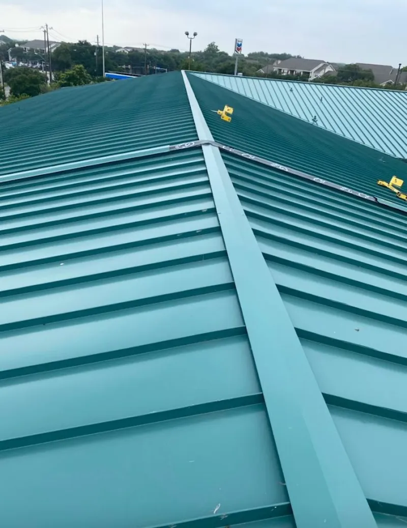 Green commercial metal roof ridge and valley for Metal Roof Repair in Millbury